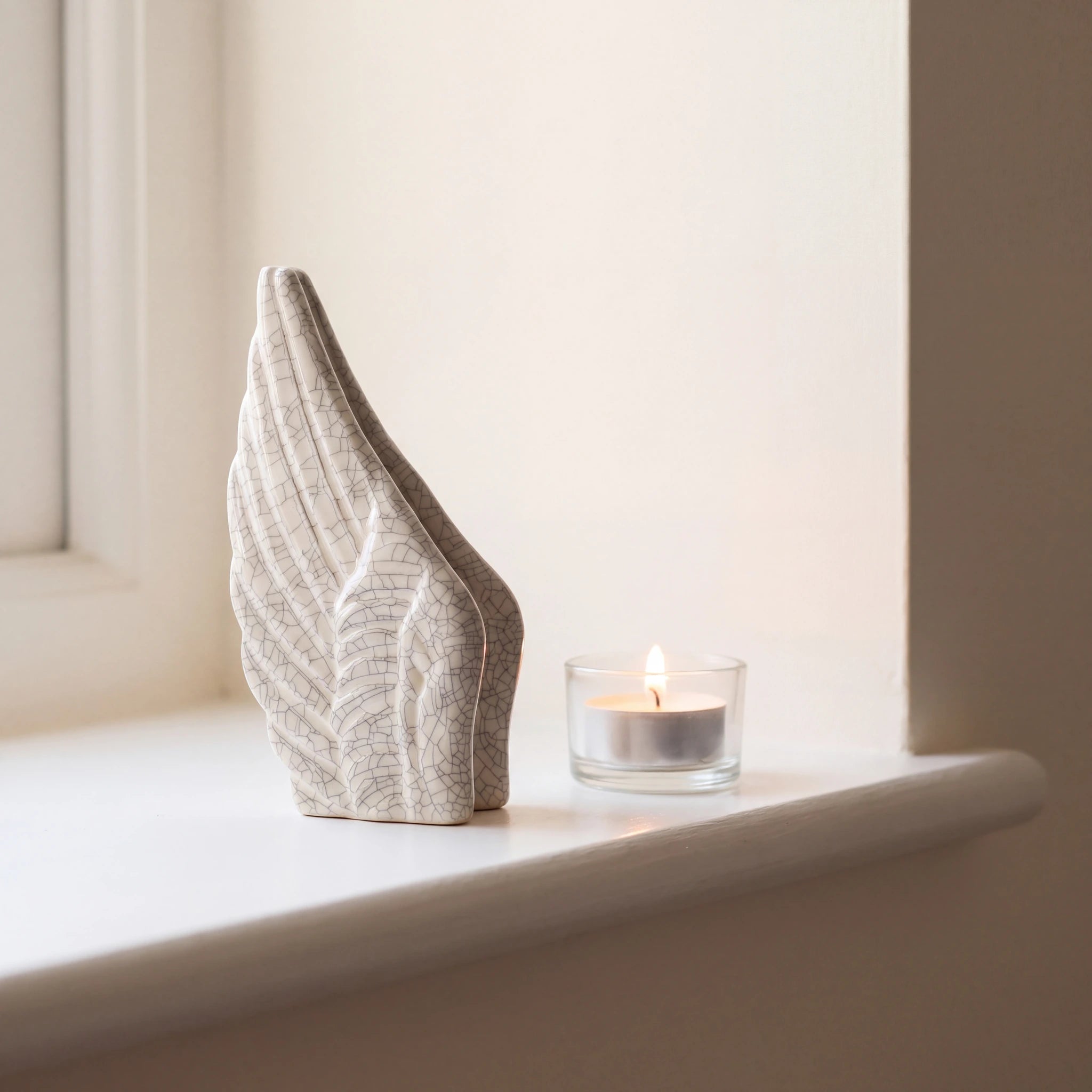 Angel-Wings-Small-Urn-for-Ashes-in-Crackle-Glaze-keepsake_tealight_ledge