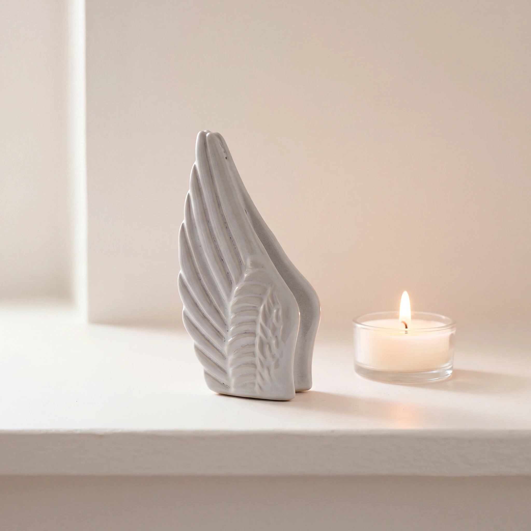 Angel-Wings-Small-Urn-for-Ashes-in-Grey-keepsake_tealight_ledge
