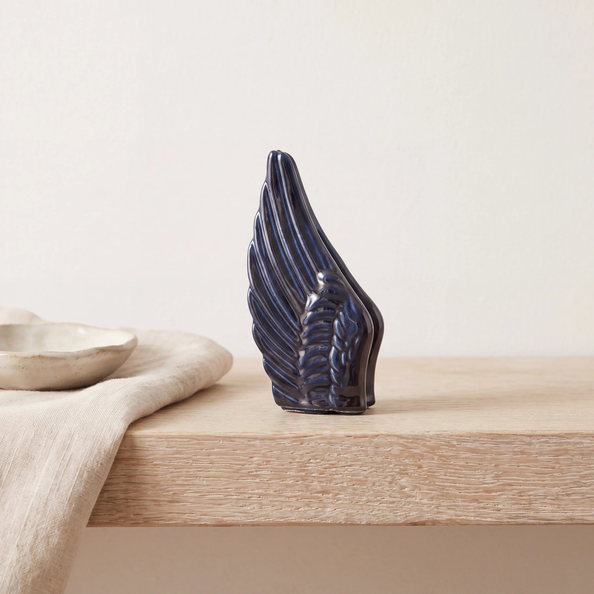 Angel-Wings-Small-Urn-for-Ashes-in-Metallic-Blue-keepsake_folded_napkin