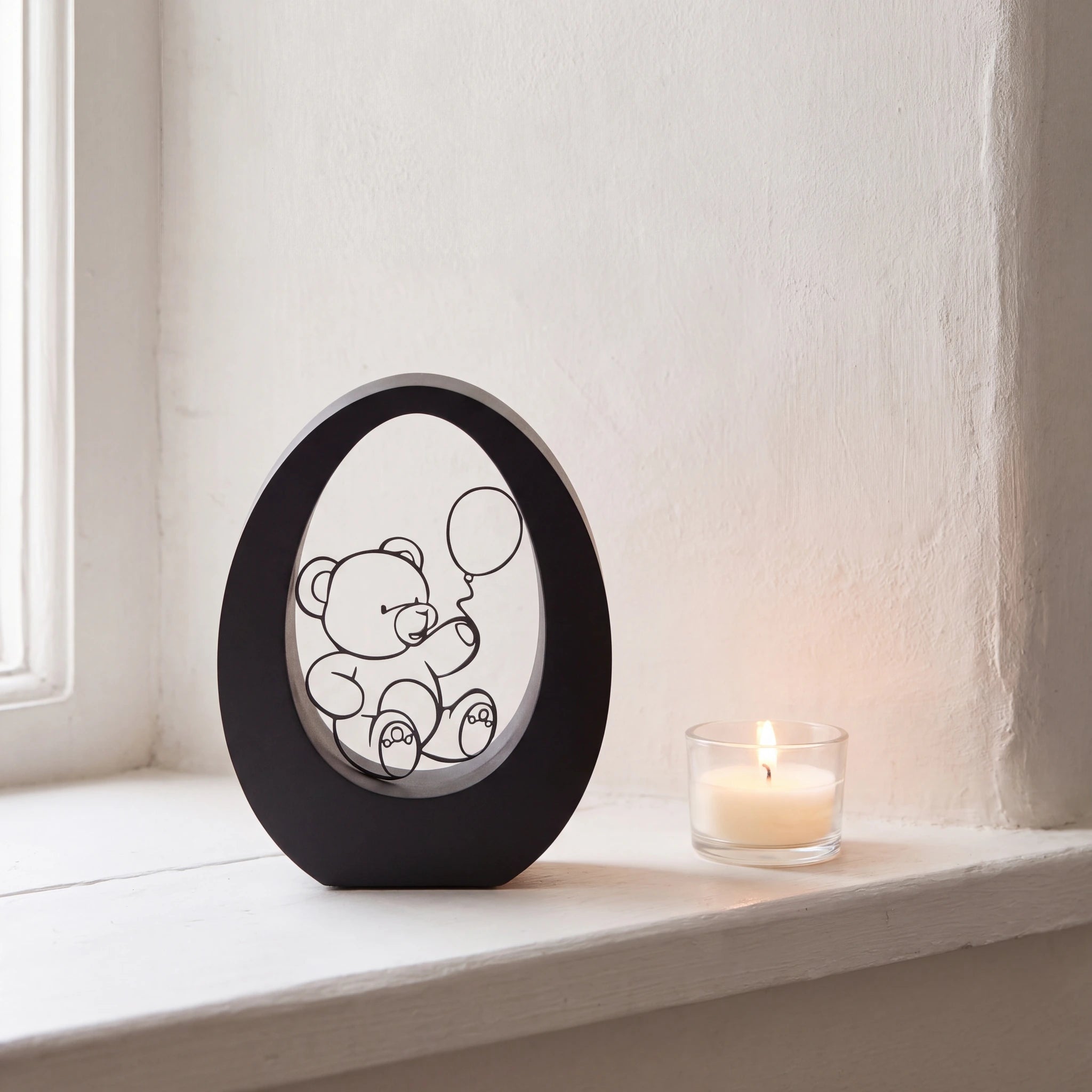 Bear-Small-Urn-for-Ashes-in-Matte-Black-Stainless-Steel-keepsake_tealight_ledge