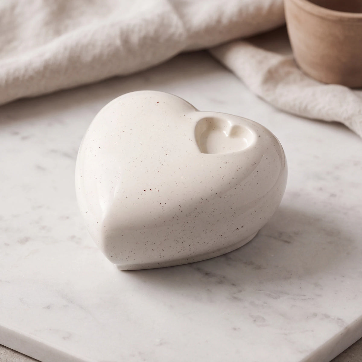 Big-Heart-Double-Urn-for-Ashes-in-Pepper-On-Marble