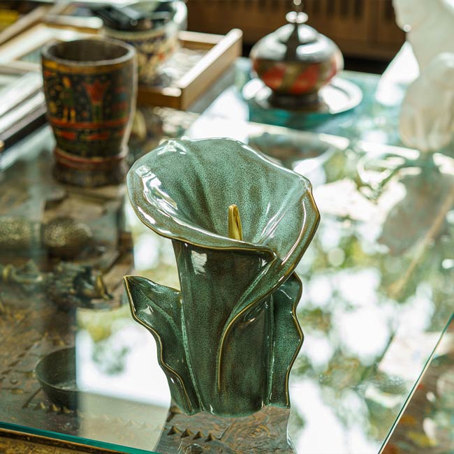 Calla Lilly Medium Cremation Urn for Ashes Oily Green on Coffee Table
