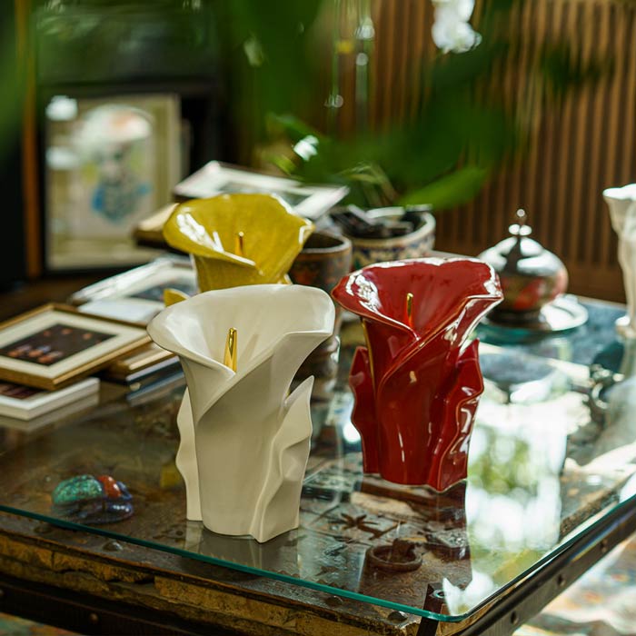 Calla Lilly Medium Cremation Urn for Ashes Red on Coffee Table with Others