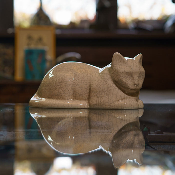 Cat Cremation Urn For Ashes Crackle Glaze Side View On Glass Table
