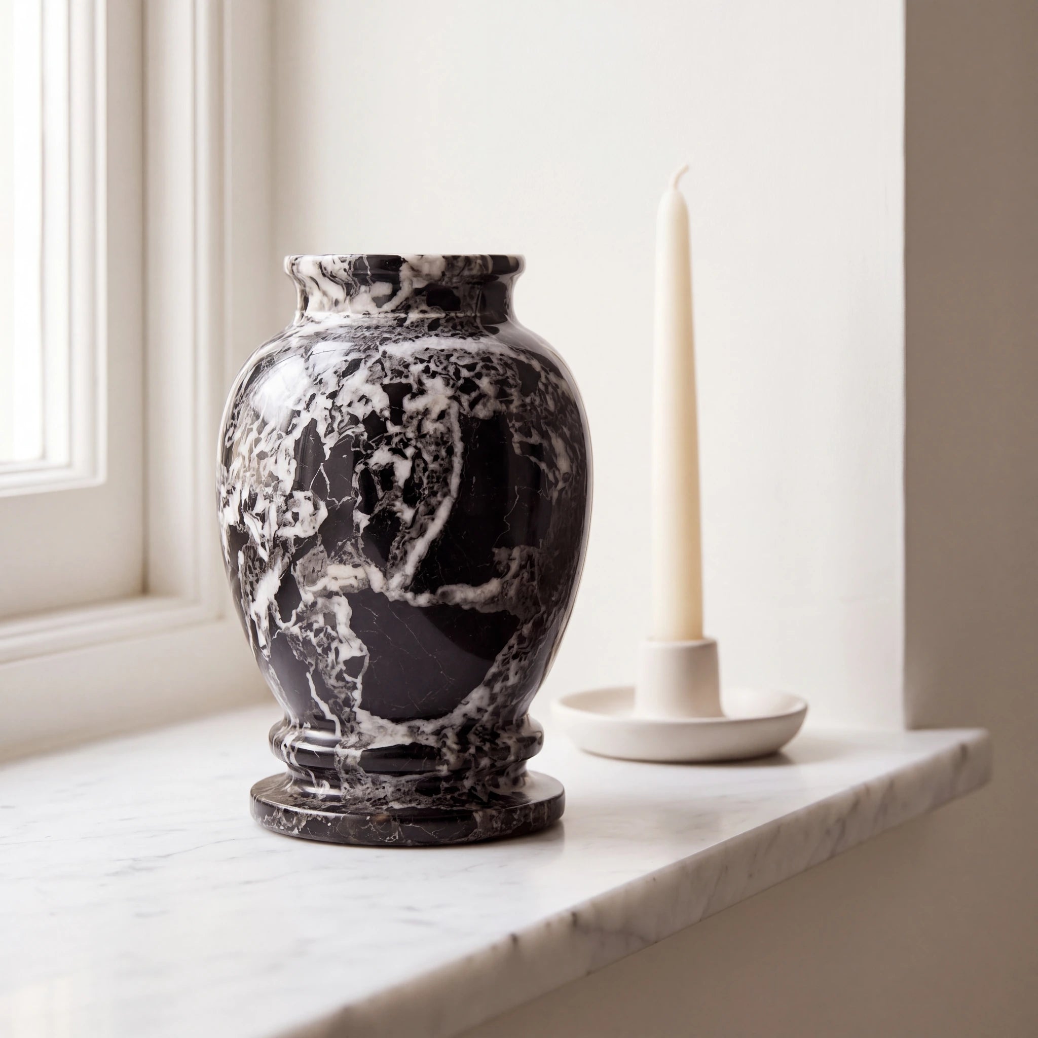 Classic-Marble-Keepsake-Urn-for-Ashes-in-Black-White-Marble-Ledge