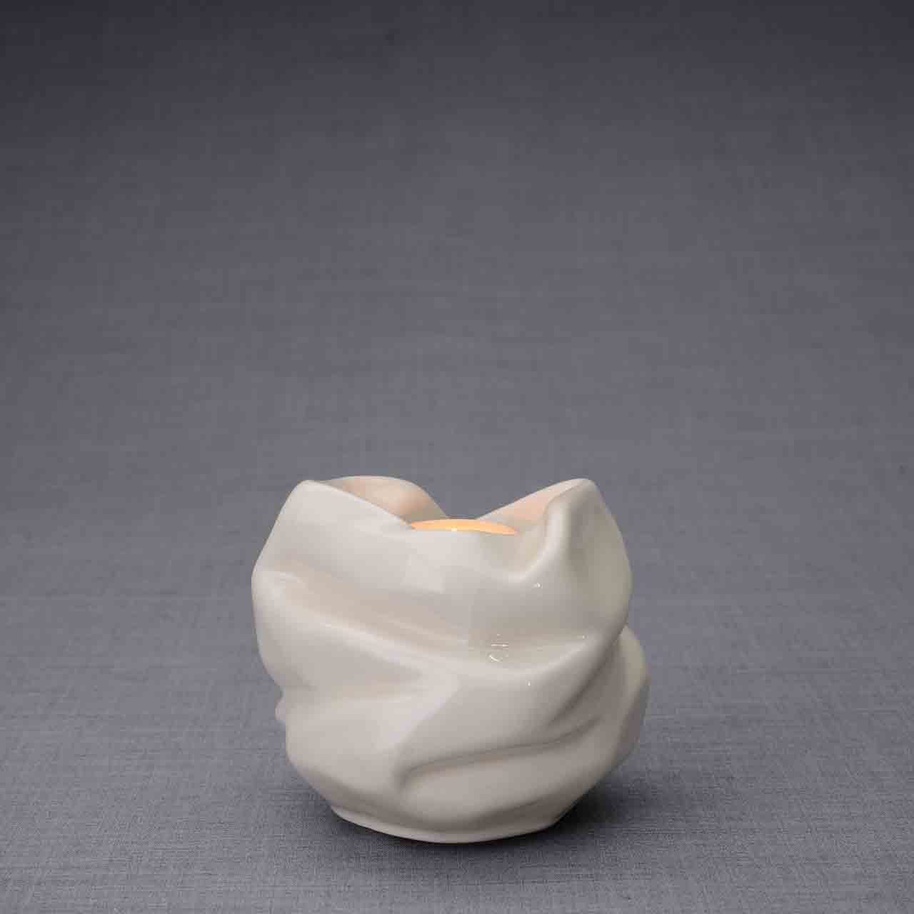 Comfort Candle Keepsake Urn in Cream Behind Dark Background