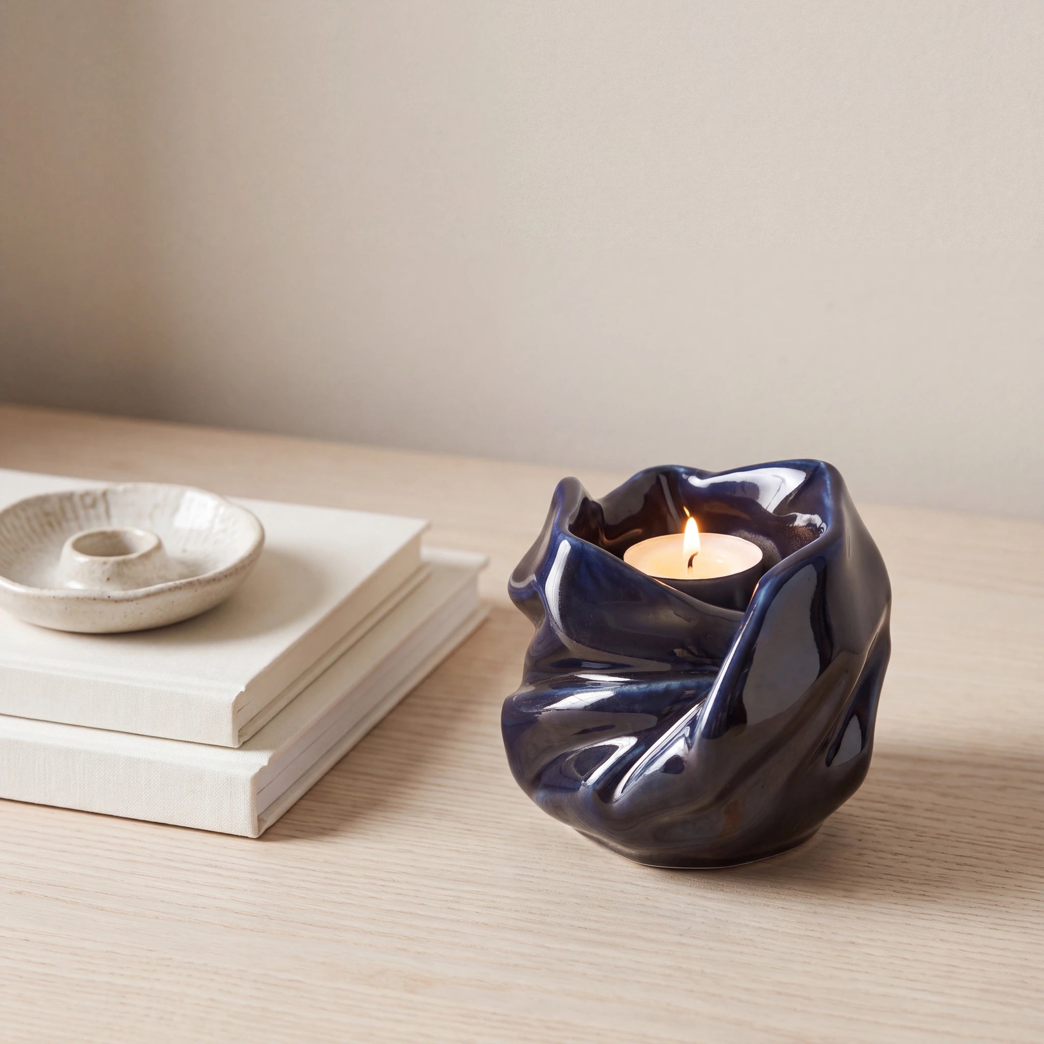 Comfort-Candle-Small-Urn-for-Ashes-in-Metallic-Blue-keepsake_books_dish-Left-Angle