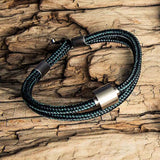 Corded Ashes Bracelet for Men in Navy on Wooden Surface