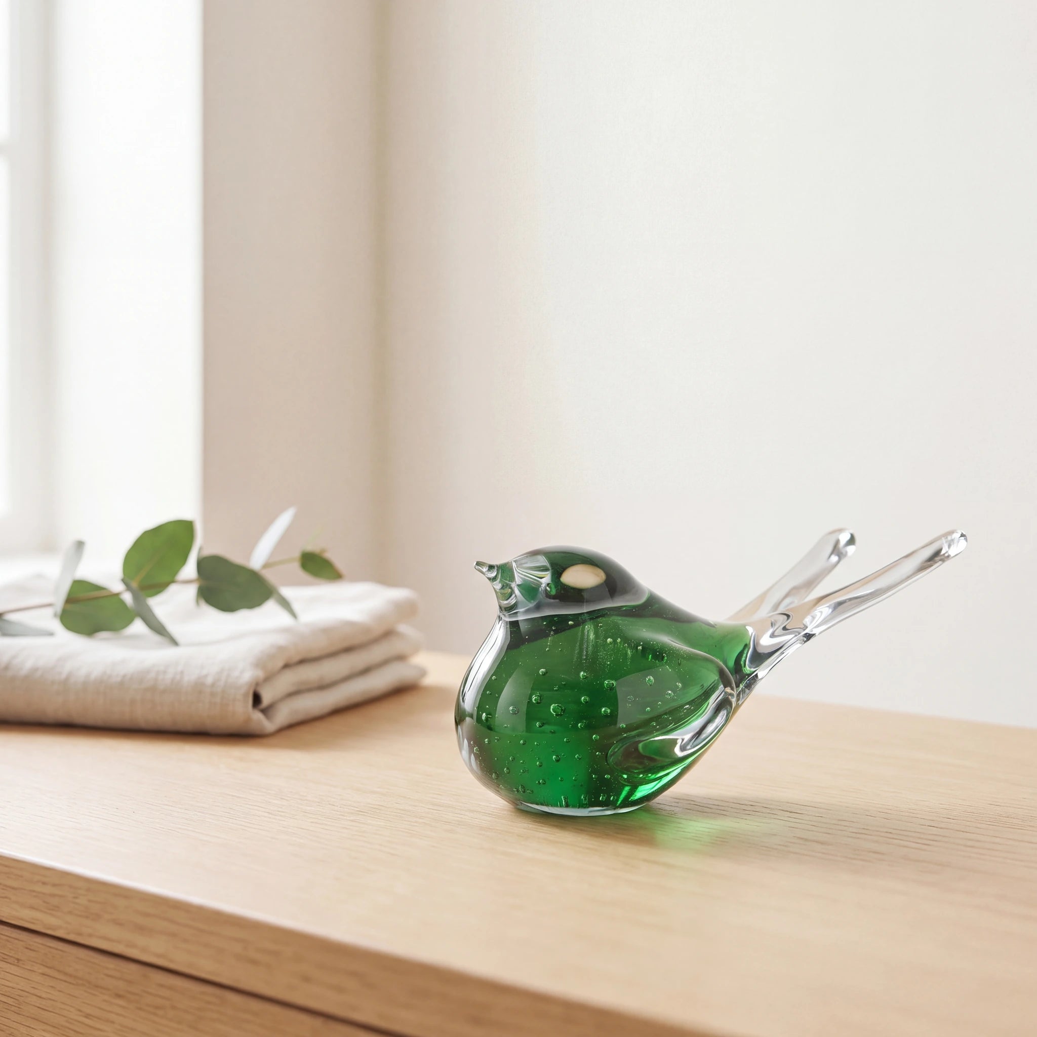 Crystal-Songbird-Keepsake-Urn-for-Ashes-in-Green-Folded-Linen