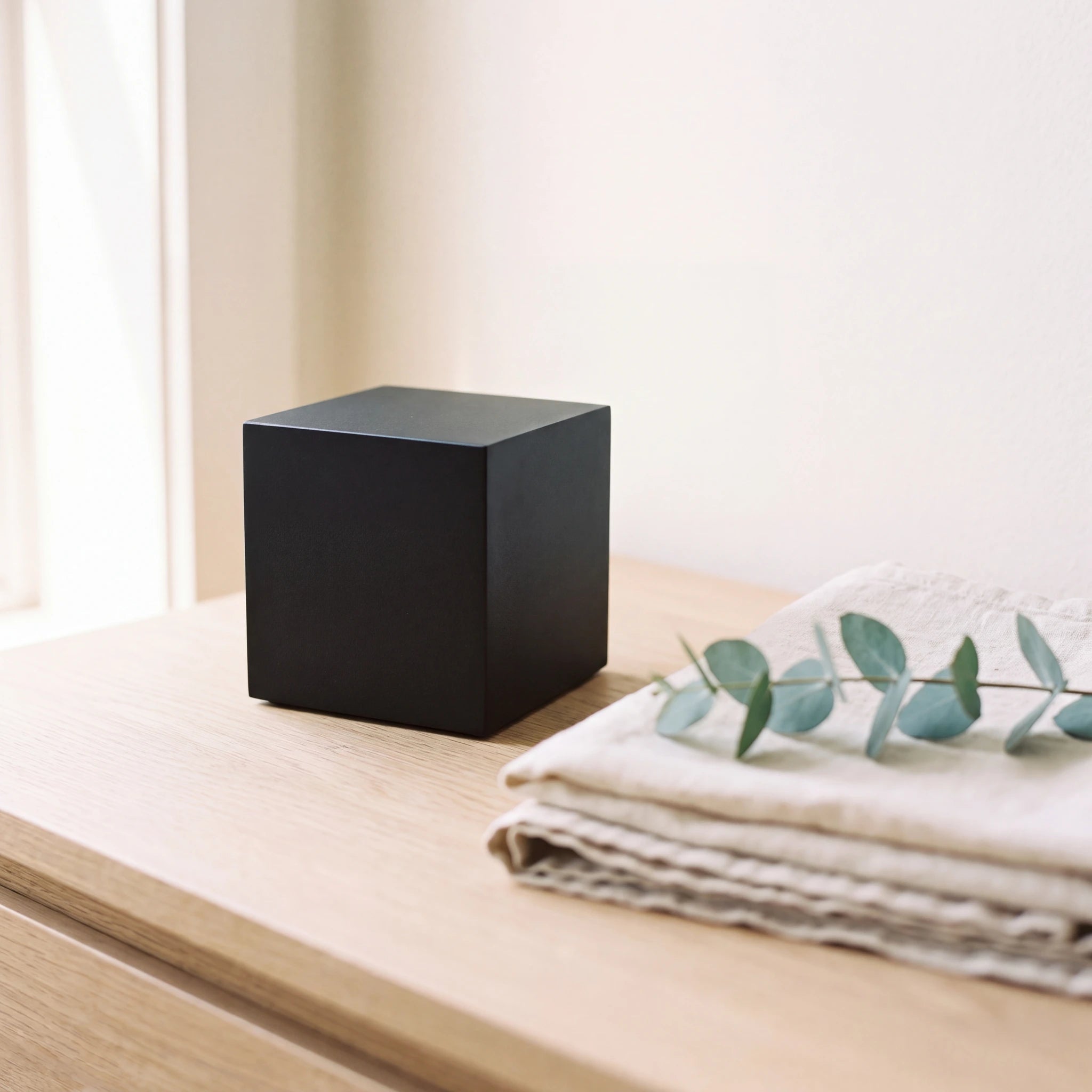 Cube-Small-Urn-for-Ashes-in-Matte-Black-Stainless-Steel-Folded-Linen
