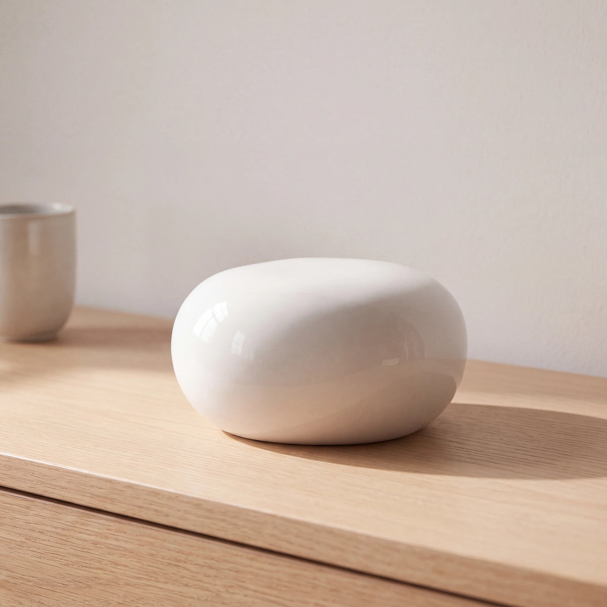 Cuddle-Stone-Keepsake-Urn-for-Ashes-in-Glossy-White-Oak-Console