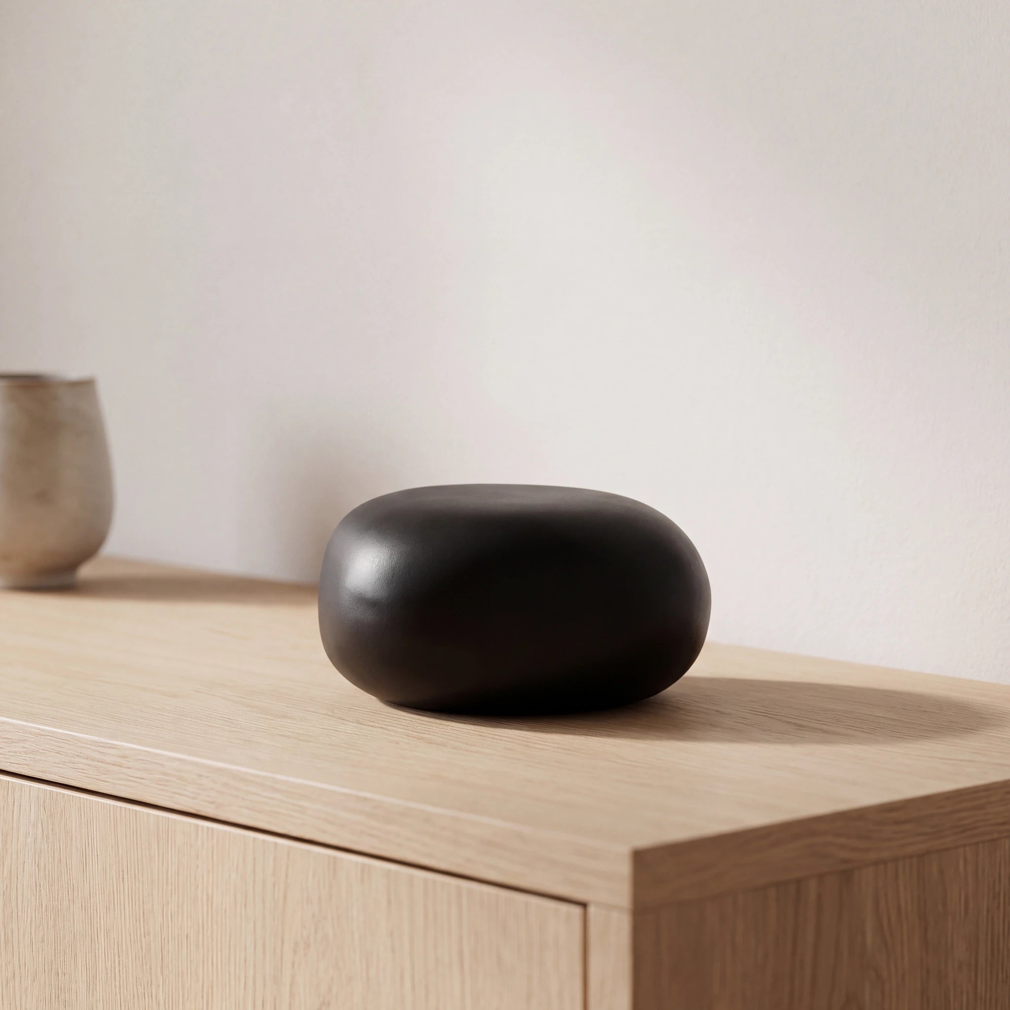 Cuddle-Stone-Keepsake-Urn-for-Ashes-in-Matte-Black-Oak-Console