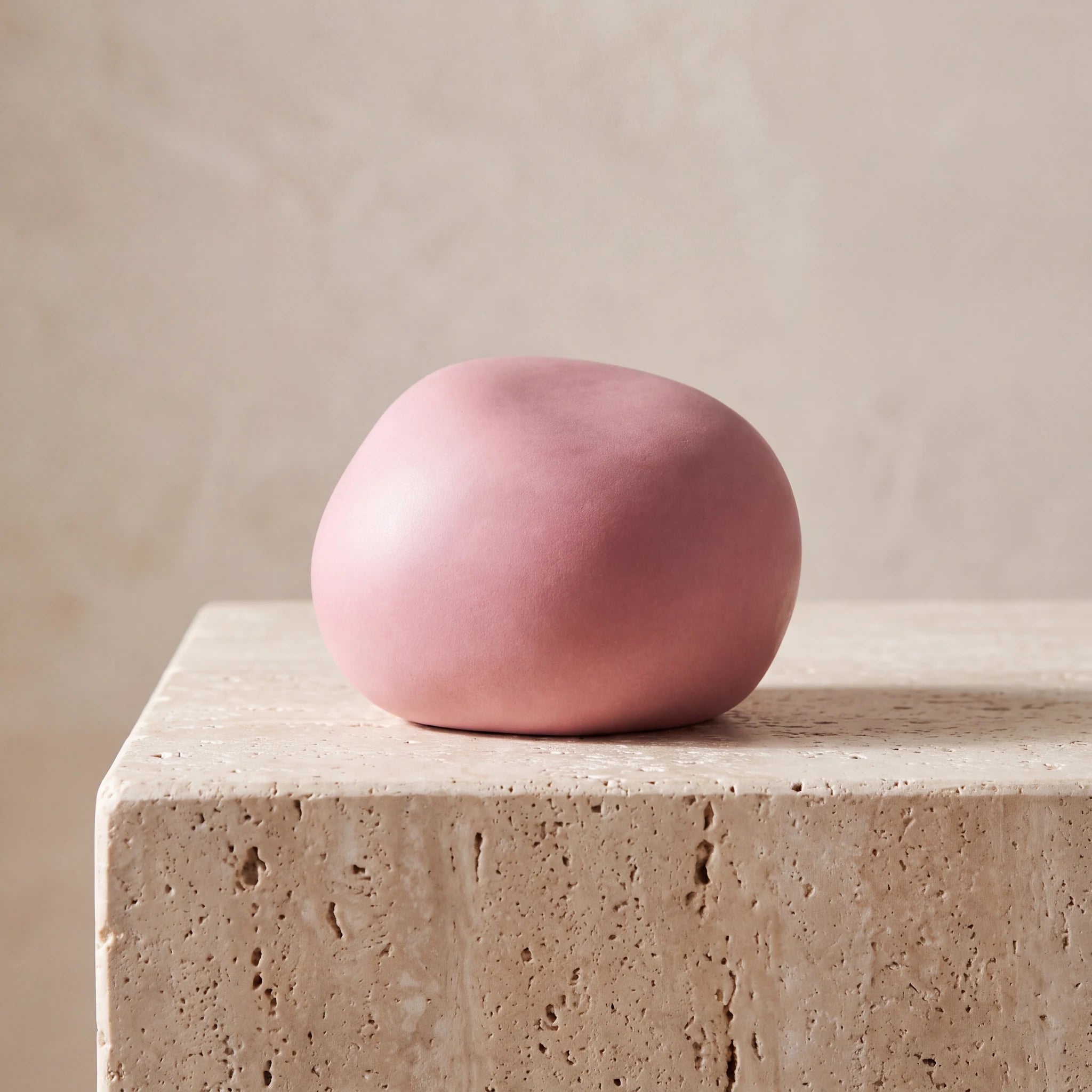 Cuddle-Stone-Keepsake-Urn-for-Ashes-in-Matte-Pink-Travertine-Ledge