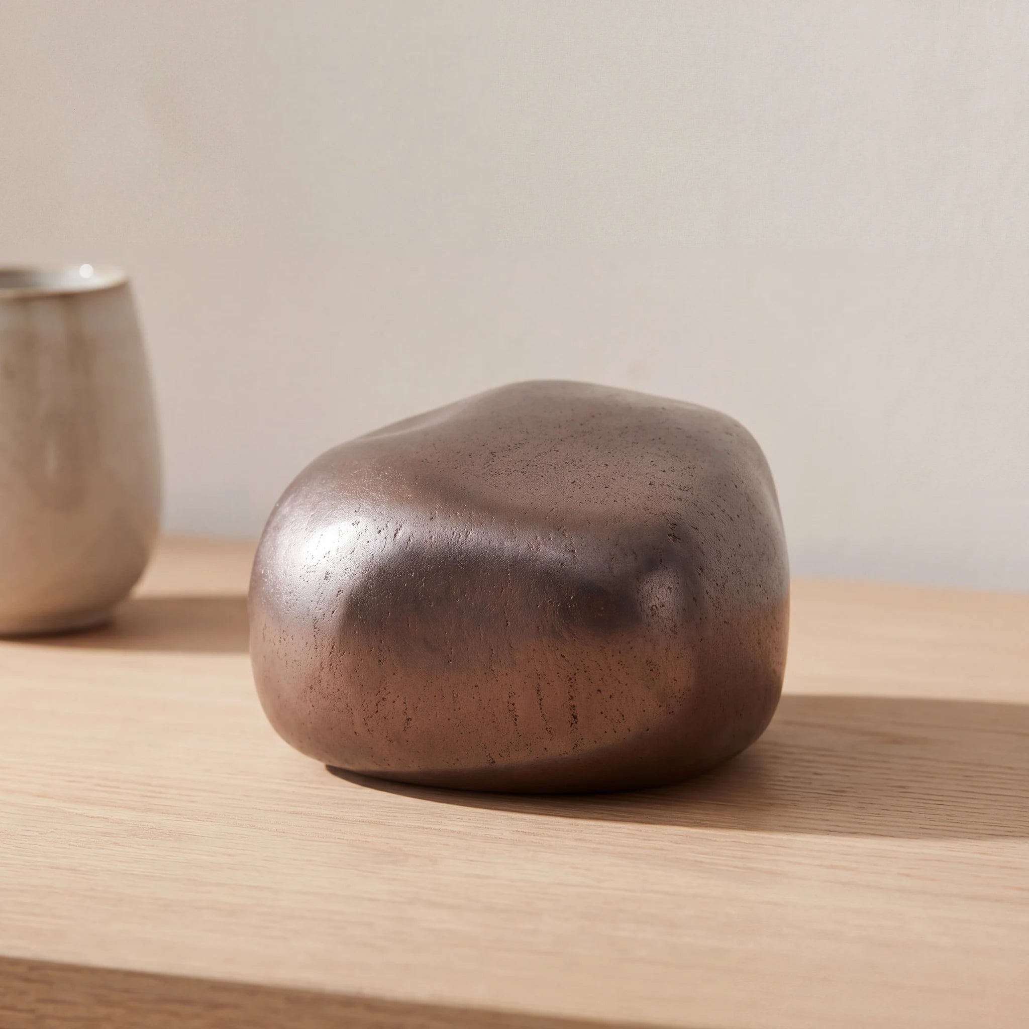 Cuddle-Stone-Keepsake-Urn-for-Ashes-in-Rustic-Bronze-Oak-Console