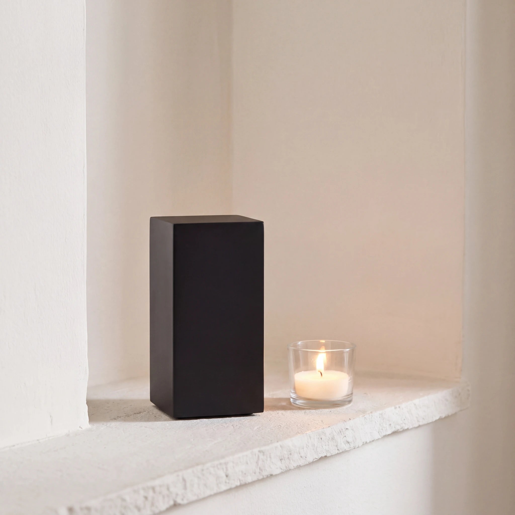Dimension-Pet-Urn-for-Ashes-in-Matte-Black-Stainless-Steel-keepsake_tealight_ledge