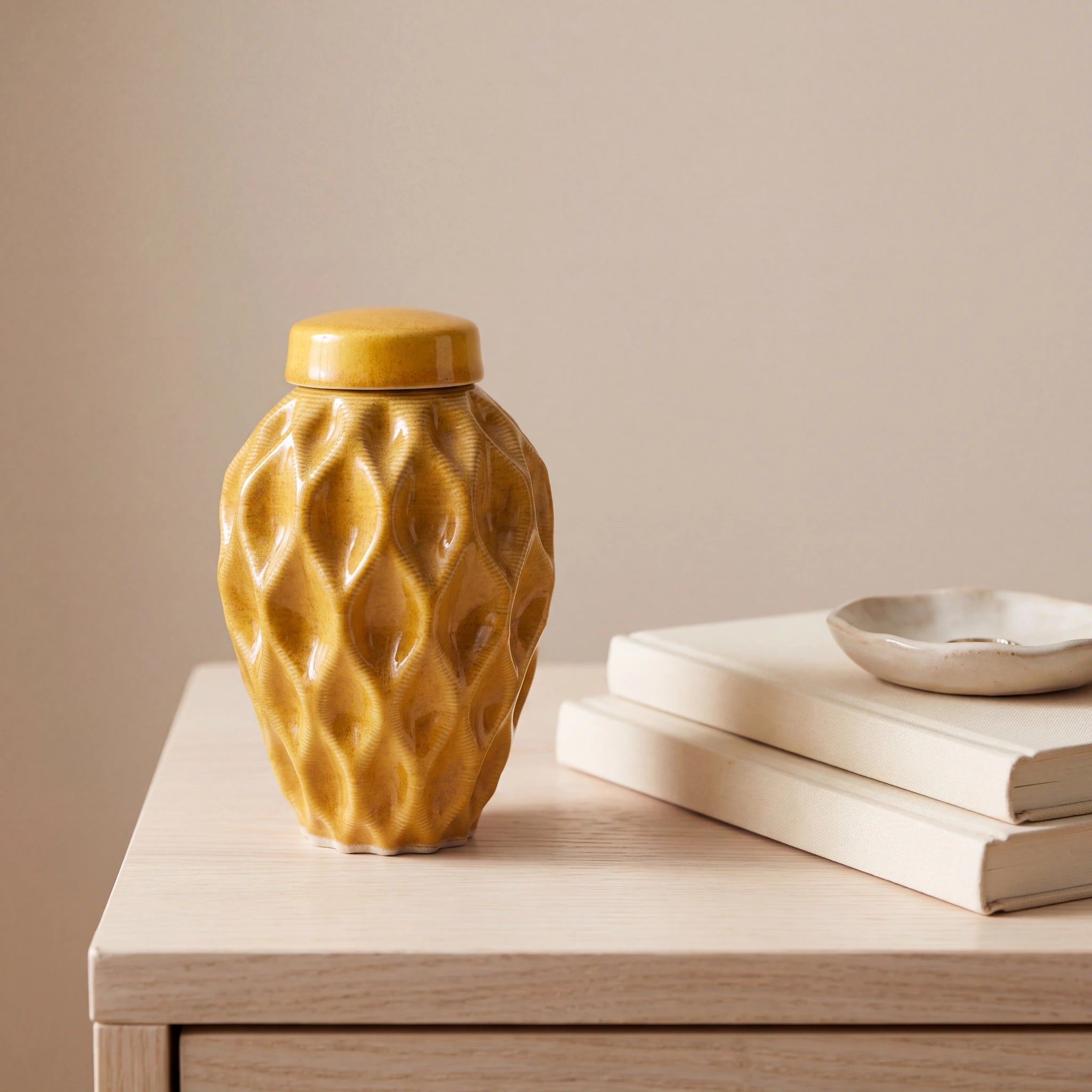 Echo-Keepsake-Urn-for-Ashes-in-Amber-Yellow-keepsake_books_dish-Left-Angle