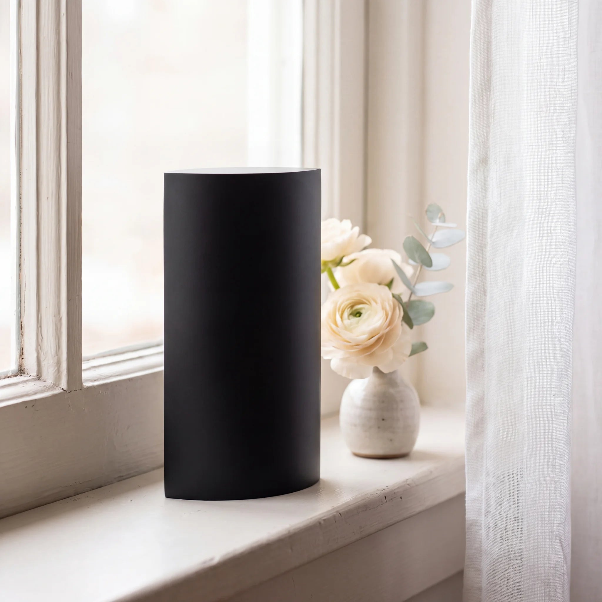 Ellipse-Small-Urn-for-Ashes-in-Matte-Black-Stainless-Steel-keepsake_windowsill_posy