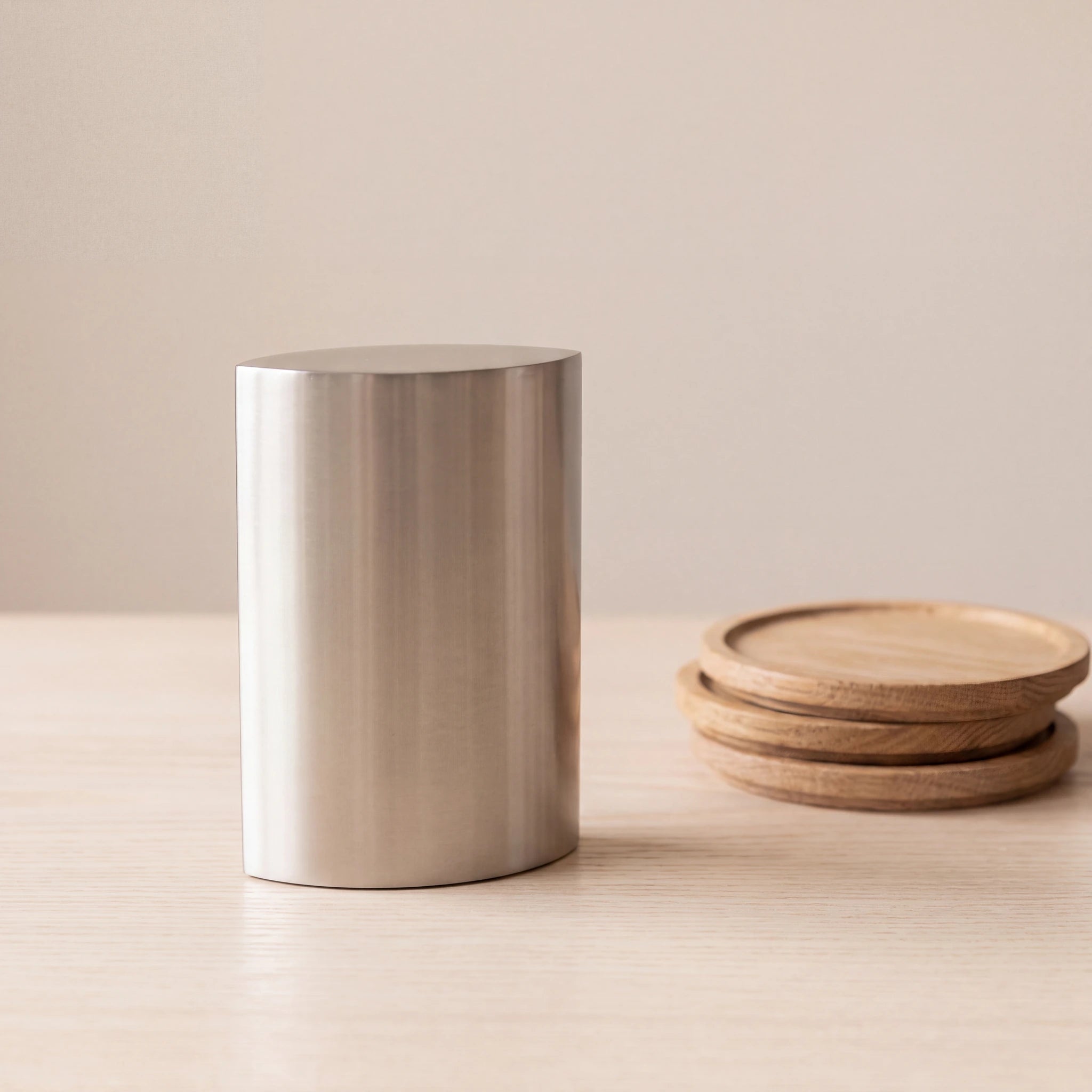 Ellipse-Small-Urn-for-Ashes-in-Stainless-Steel-keepsake_stacked_coasters
