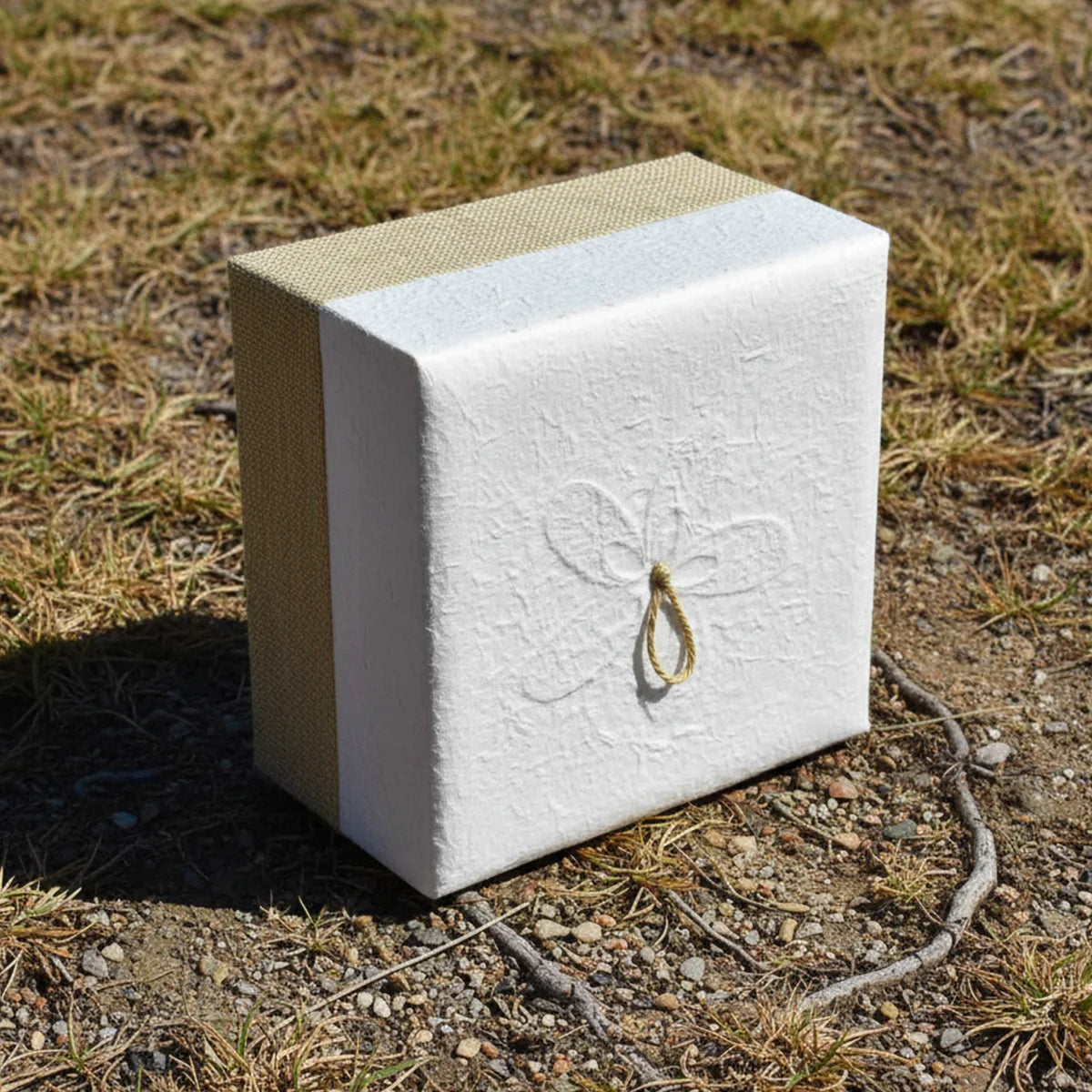 Embrace Biodegradable Urn for Ashes for Adult in White Hemp Outside Left in Daylight