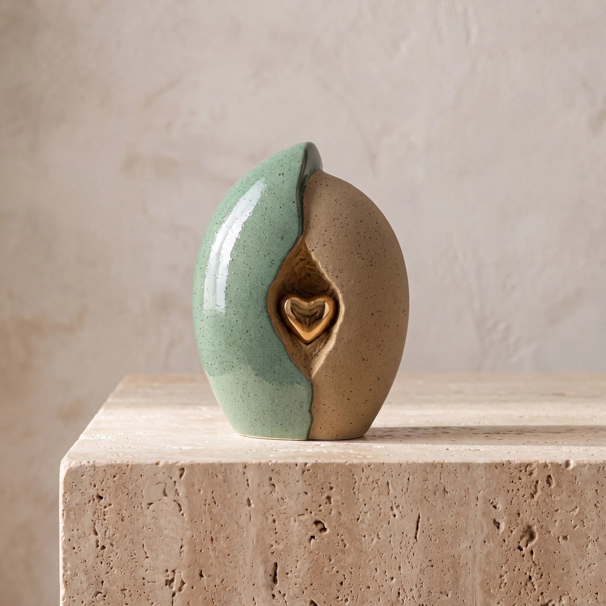 Embrace-Heart-Medium-Urn-for-Ashes-in-Fern-Green-and-Sand-Travertine-Ledge
