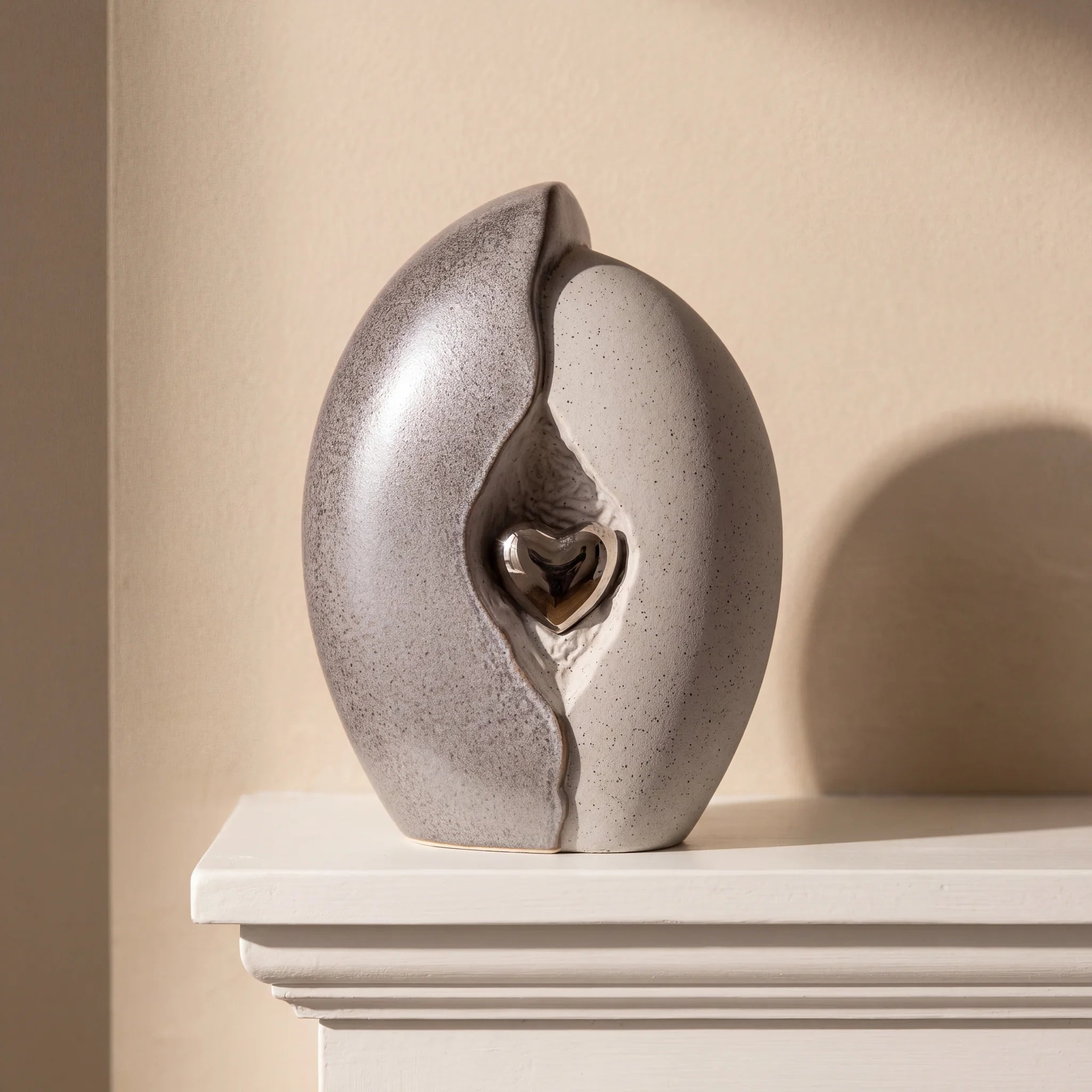 Embrace-Heart-Medium-Urn-for-Ashes-in-Grey-and-Silver-Mantelpiece