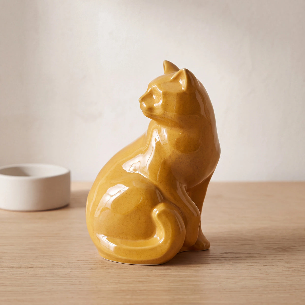 Felix-Cat-Urn-for-Ashes-in-Amber-Yellow-pet_bowl_ledge