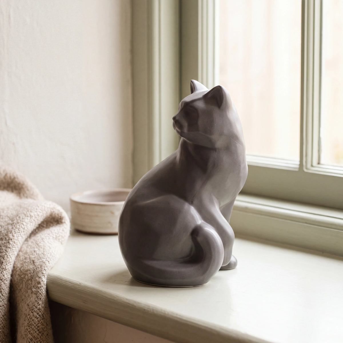 Felix-Cat-Urn-for-Ashes-in-Matte-Grey-pet_sunny_sill