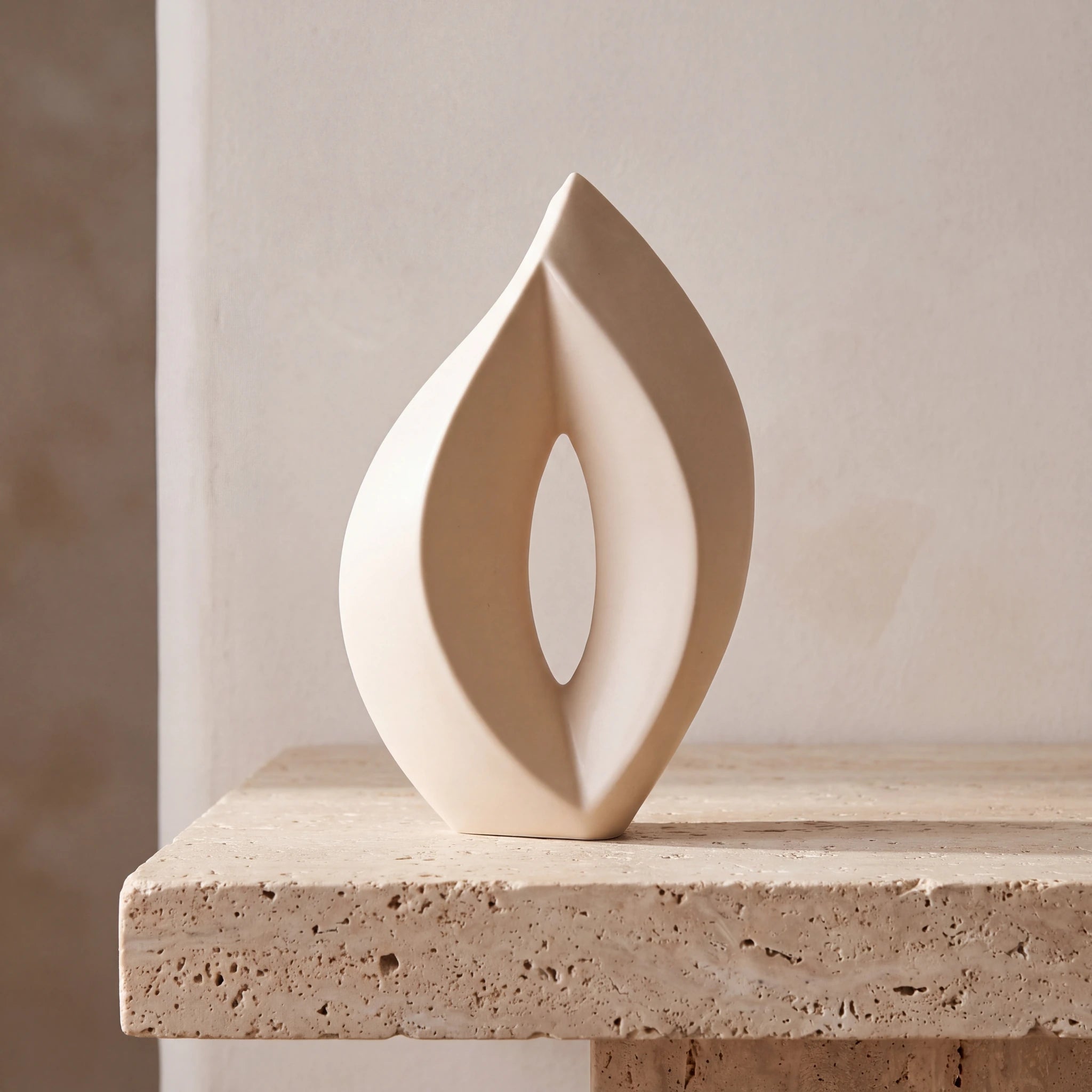 Flame-Medium-Urn-for-Ashes-in-Cream-Travertine-Ledge