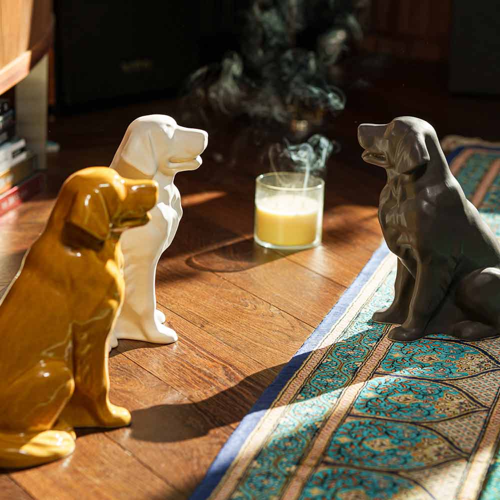 Golden Retriever Pet Urn for Ashes in Gold And Matte White and Matte Grey on Rug Facing Each Other