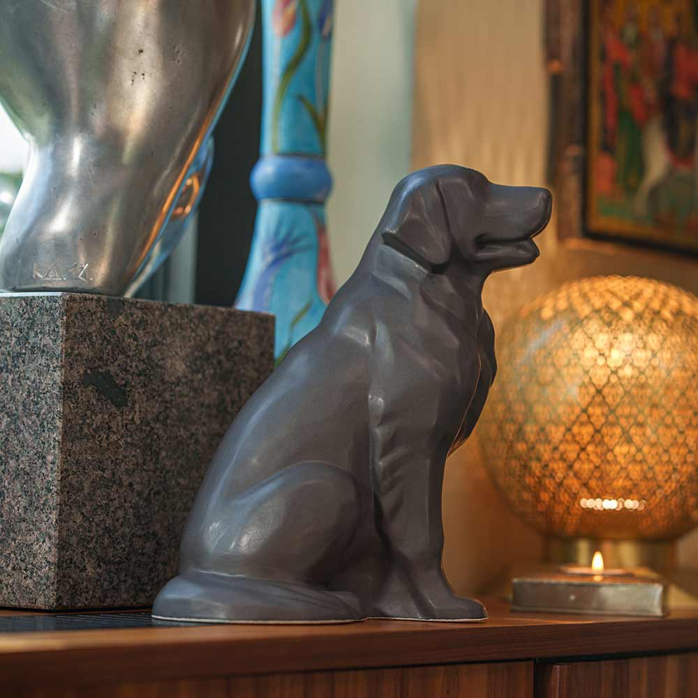 Golden Retriever Pet Urn for Ashes in Matte Grey on Shelf Facing Right