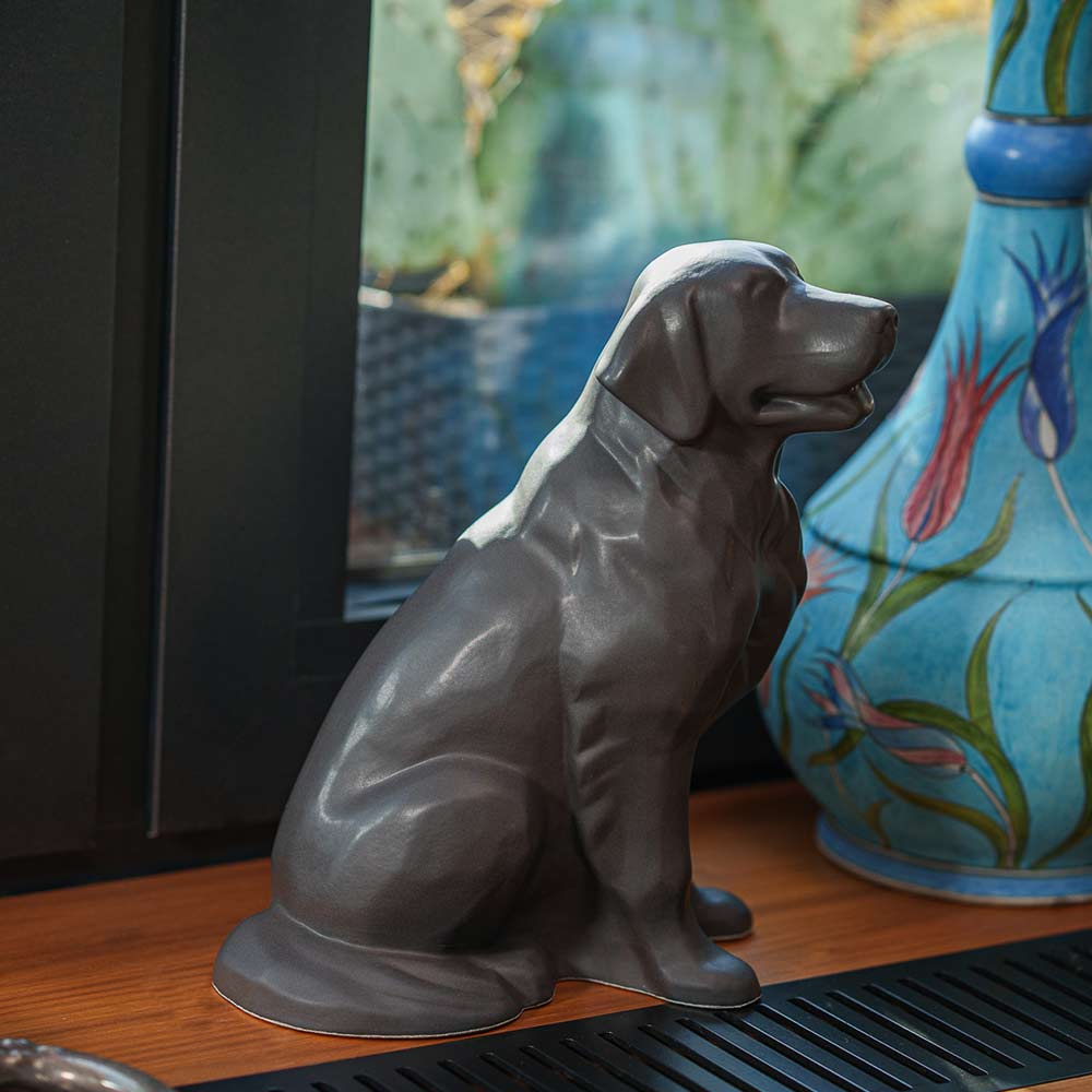 Golden Retriever Pet Urn for Ashes in Matte Grey on Shelf Next to Vase