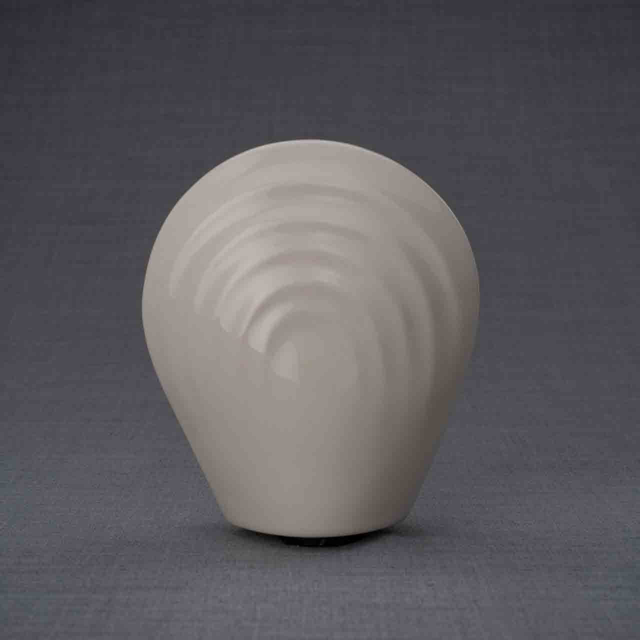Guardian Angel Ashes Keepsake Urn in Cream Behind Grey Background