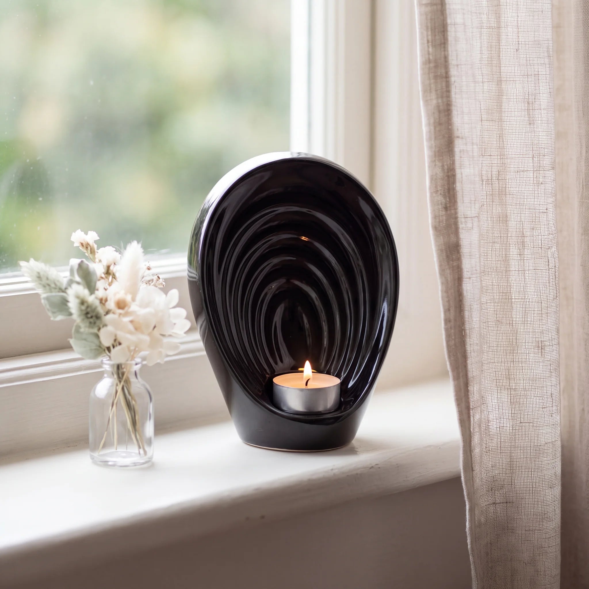 Guardian-Angel-Small-Urn-for-Ashes-in-Black-keepsake_windowsill_posy-Left-Angle