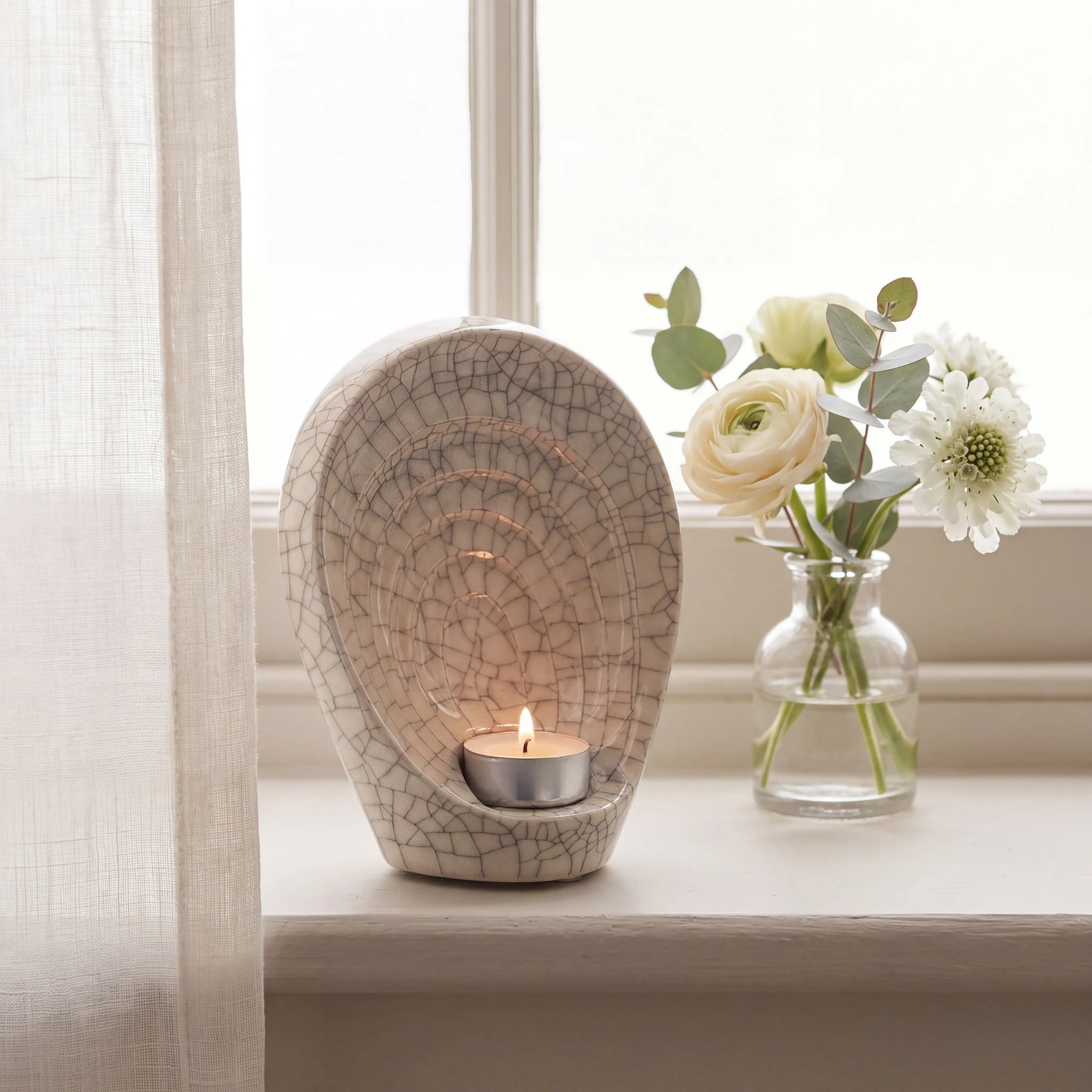 Guardian-Angel-Small-Urn-for-Ashes-in-Crackle-Glaze-keepsake_windowsill_posy-Left-Angle