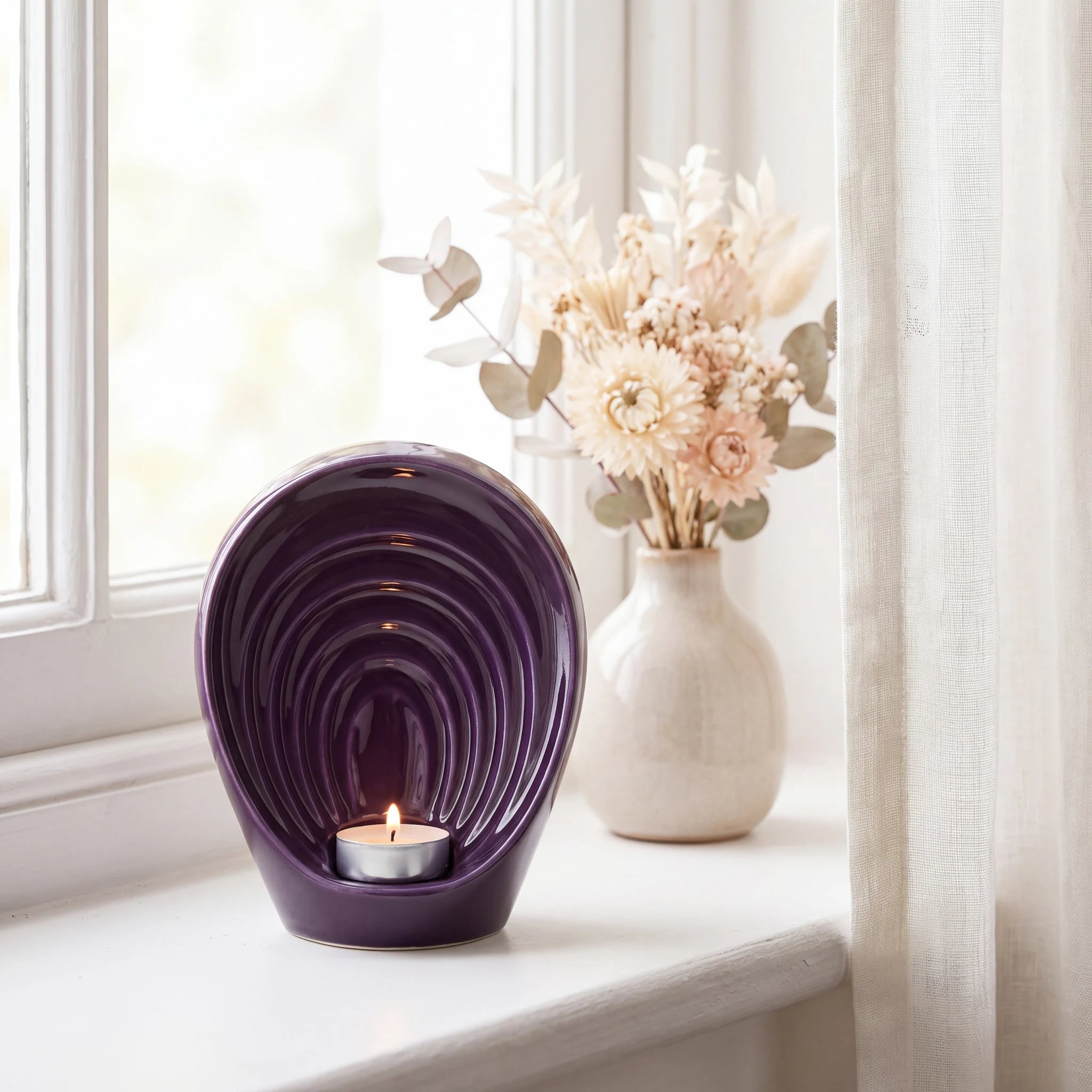 Guardian-Angel-Small-Urn-for-Ashes-in-Purple-keepsake_windowsill_posy-Left-Angle
