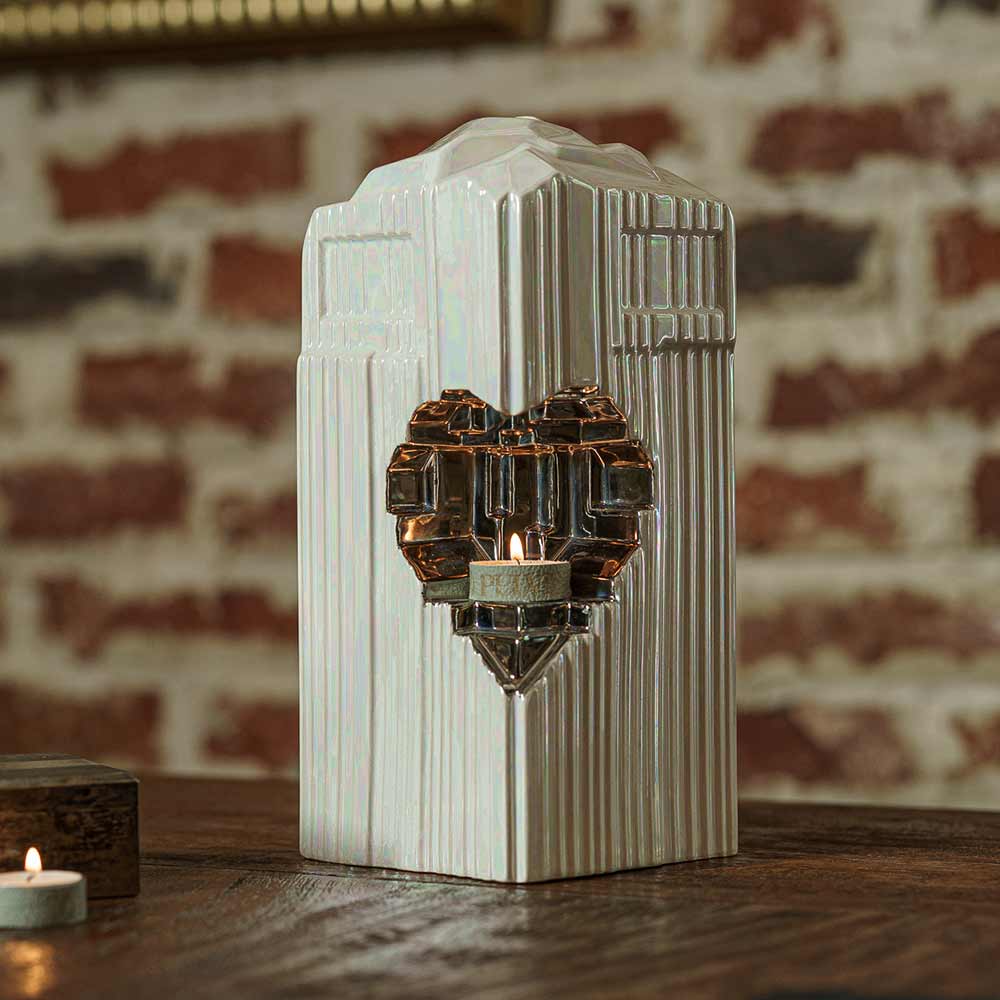 Heart Adult Cremation Urn for Ashes in Pearlescent White and Platinum on Table