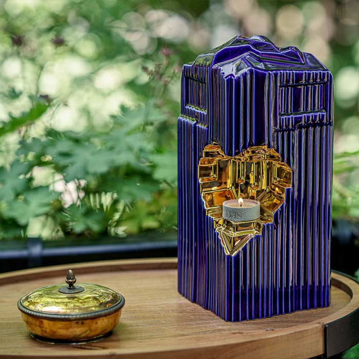 Heart Cremation Urn for Ashes Metallic Blue and Gold Outside in Bushes