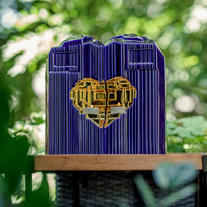 Heart Cremation Urn for Ashes Metallic Blue and Gold with Companion Outside in Bushes