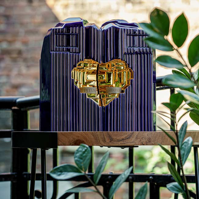 Heart Cremation Urn for Ashes Metallic Blue and Gold with Companion Outside on Table