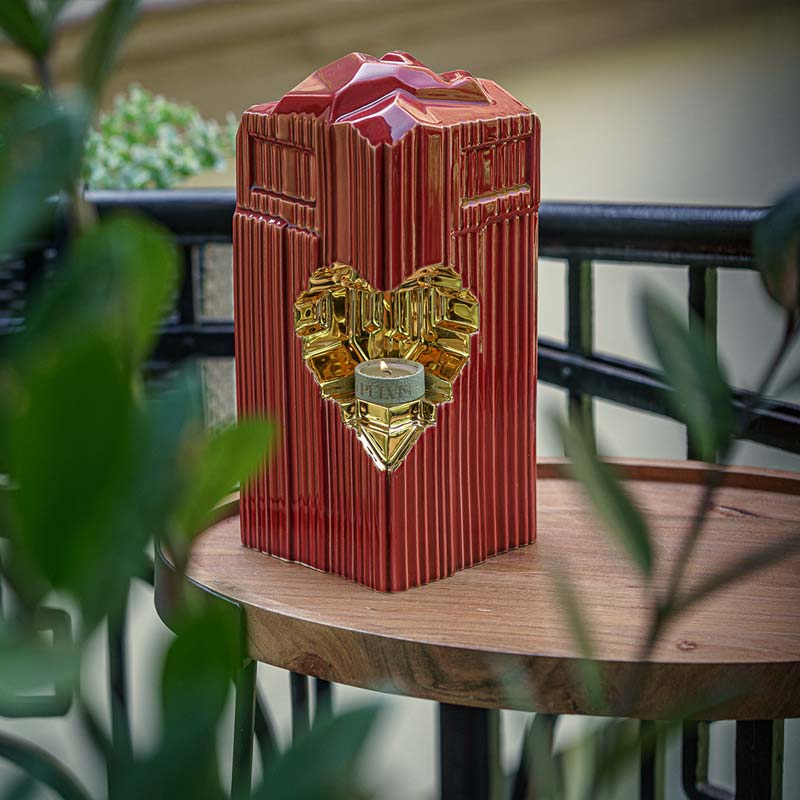 Heart Cremation Urn for Ashes Red and Gold Outside on Table