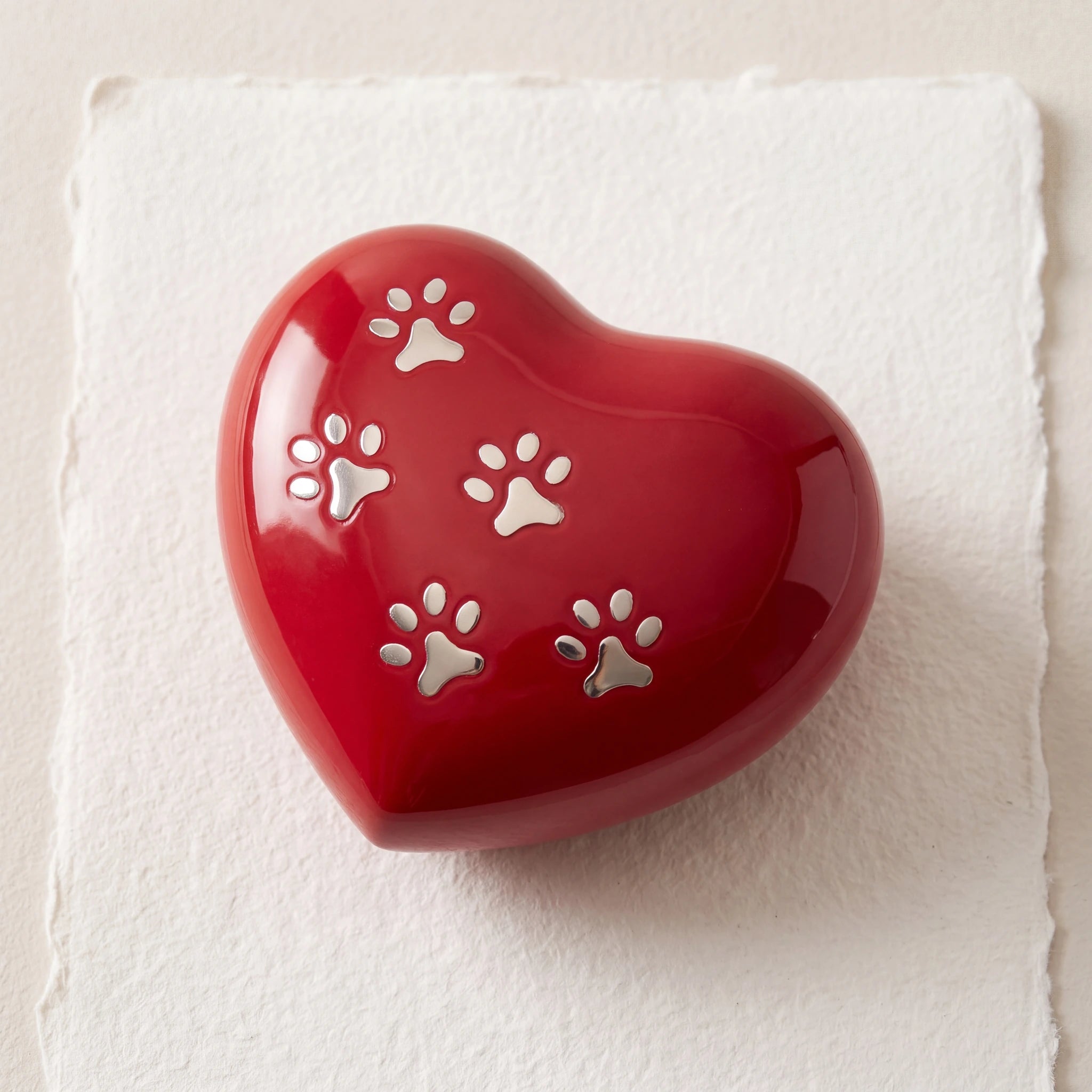 Heart-Pawprints-Pet-Keepsake-Urn-for-Ashes-in-Red-Gold-heart_paper_above