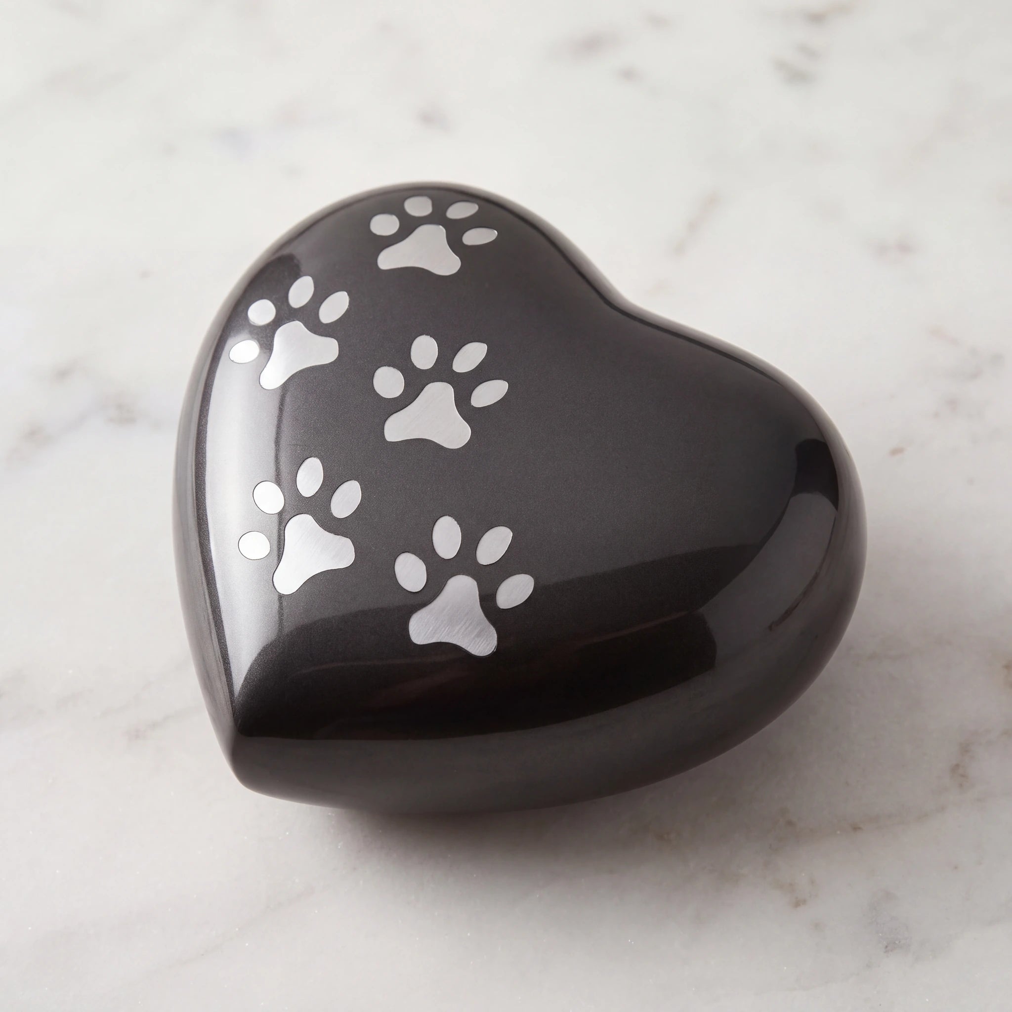 Heart-Pawprints-Pet-Small-Urn-for-Ashes-in-Graphite-Silver-On-Marble
