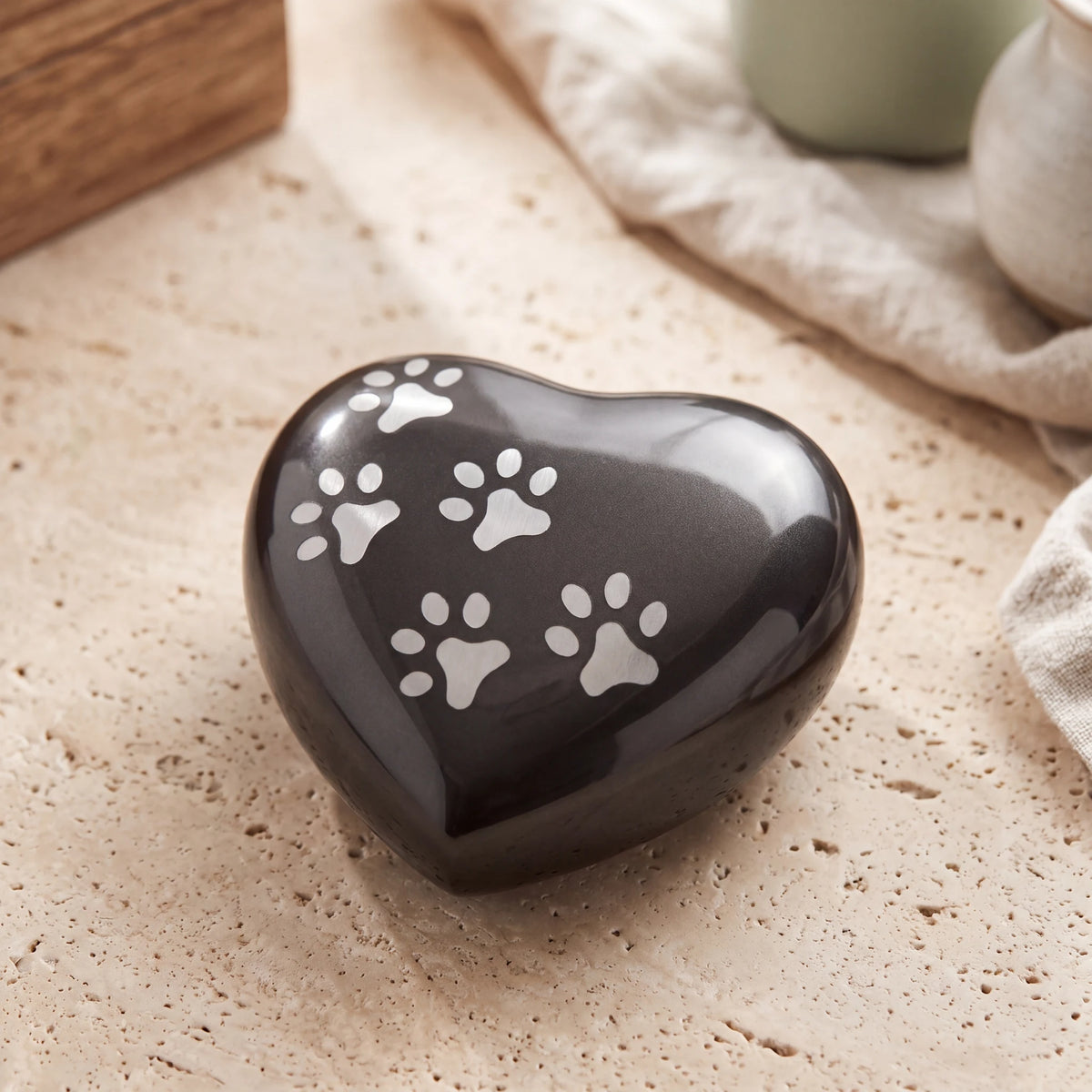 Heart-Pawprints-Pet-Small-Urn-for-Ashes-in-Graphite-Silver-On-Travertine