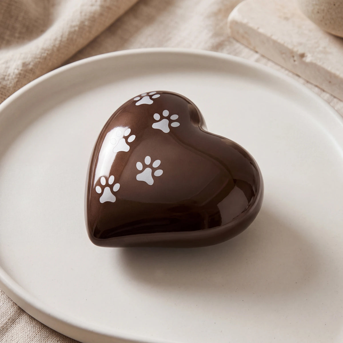 Heart-Pawprints-Pet-Urn-for-Ashes-in-Bronze-Silver-Large-heart_stoneware_above