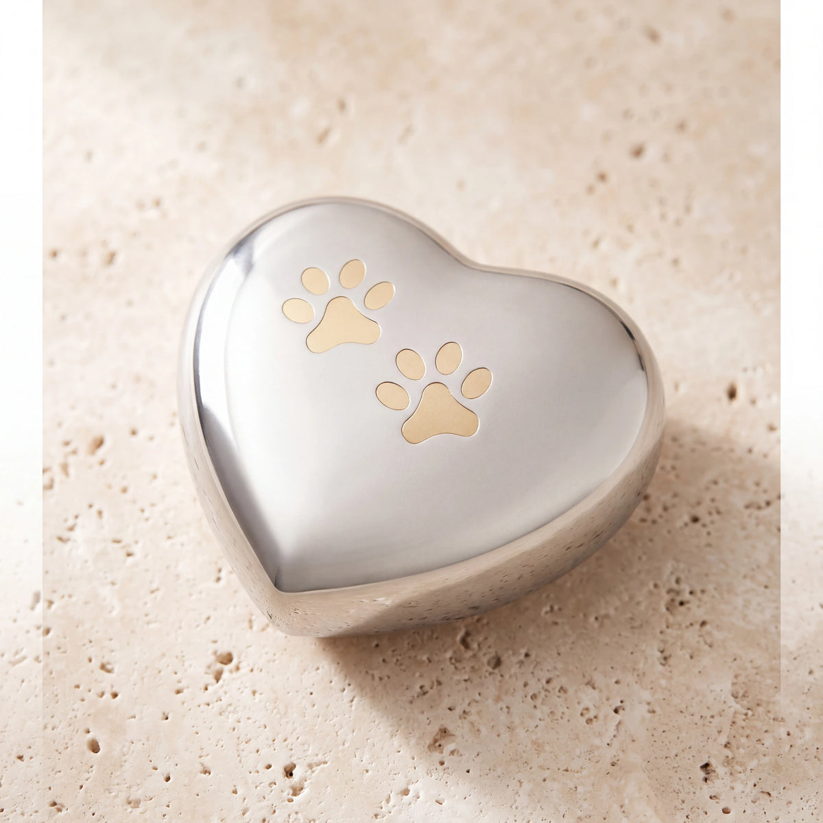 Heart-Pawprints-Pet-Urn-for-Ashes-in-Gold-Silver-On-Travertine