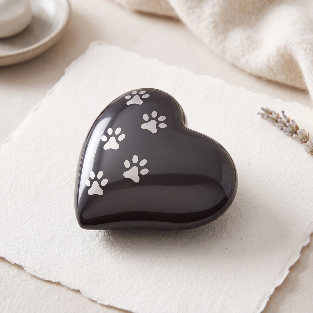Heart-Pawprints-Pet-Urn-for-Ashes-in-Graphite-Silver-Large-heart_paper_above
