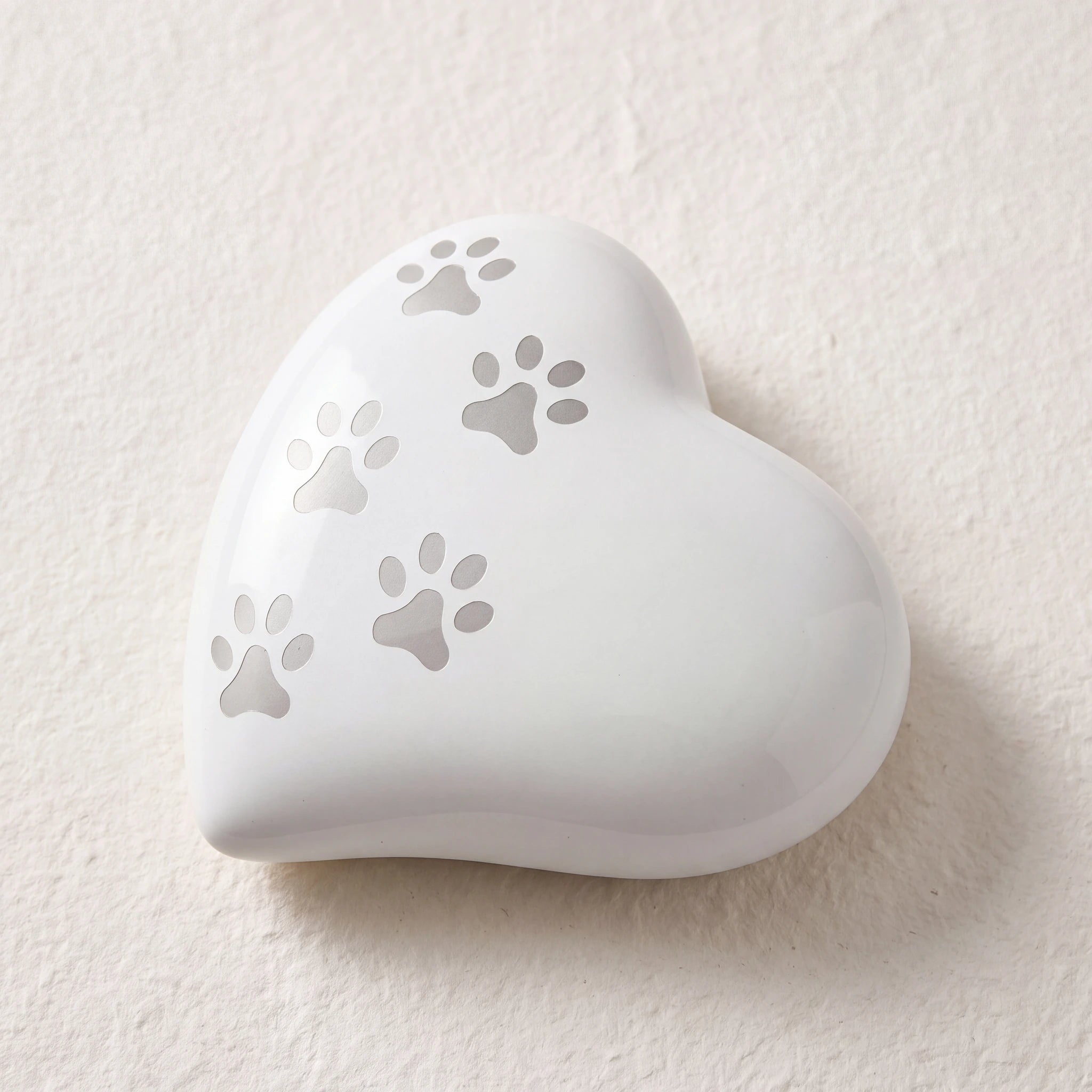 Heart-Pawprints-Pet-Urn-for-Ashes-in-White-Silver-Medium-heart_paper_above