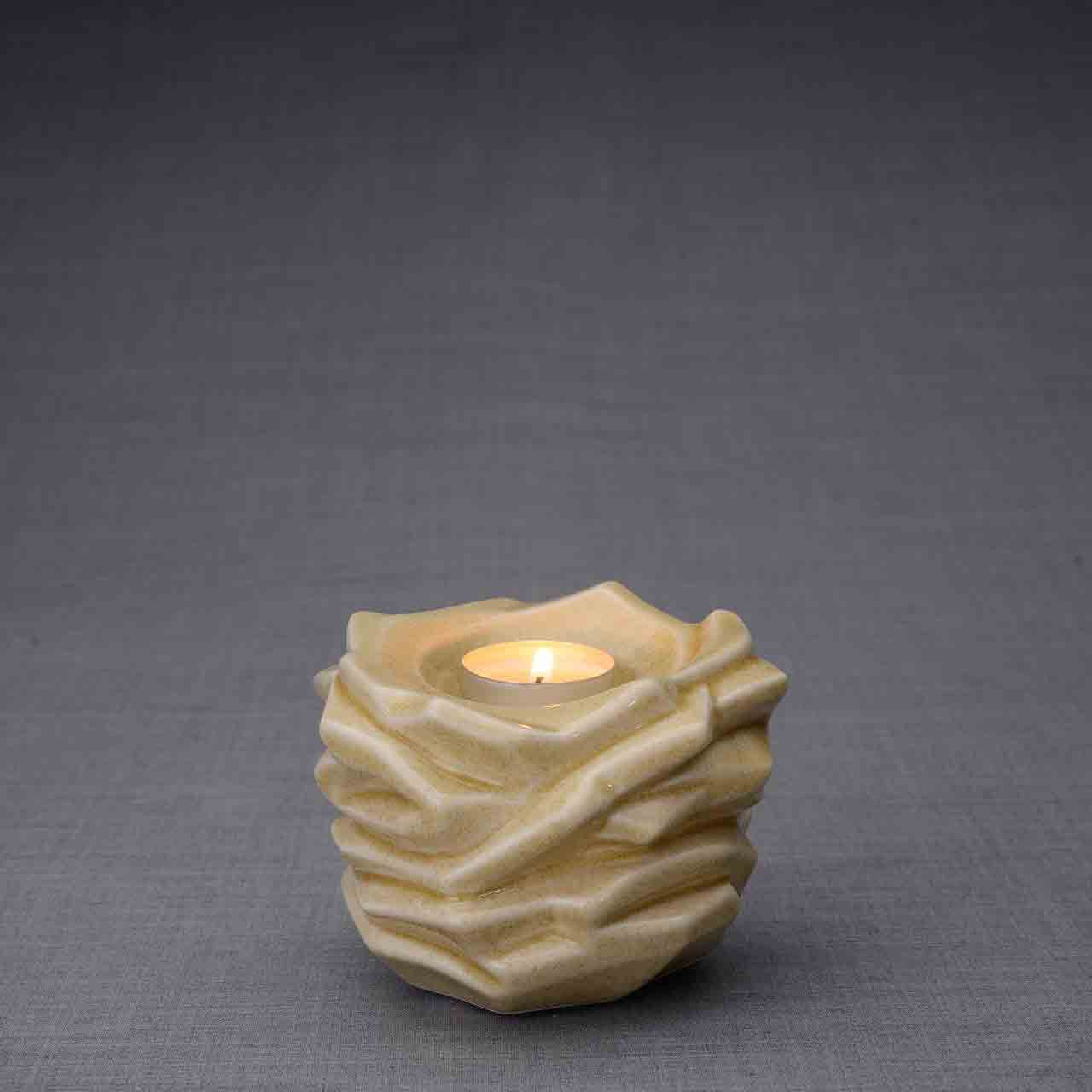 Illumination Candle Keepsake Urn in Light Sand Dark Background