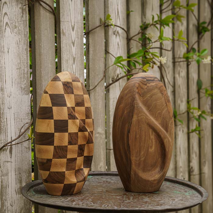 Infinity Wooden Adult Urn for Ashes Chequered and Walnut on Table in Garden Outside