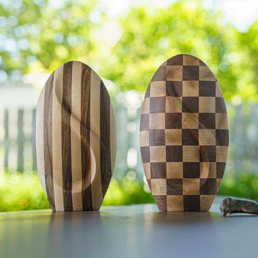 Infinity Wooden Adult Urn for Ashes Striped and Chequered on Shelf Outside